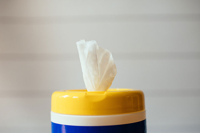 Yellow blue and white wipes holder