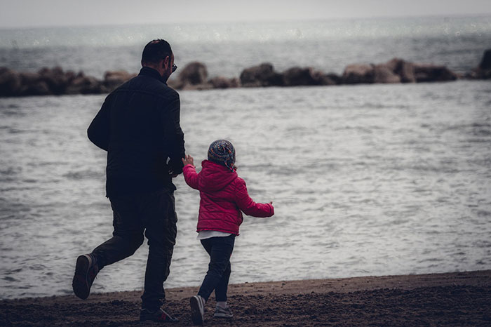 Father and child running