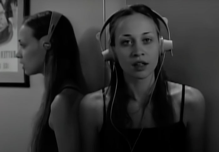 Woman with headphones singing 