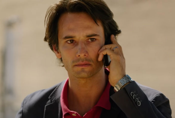 Laurence talking on the phone