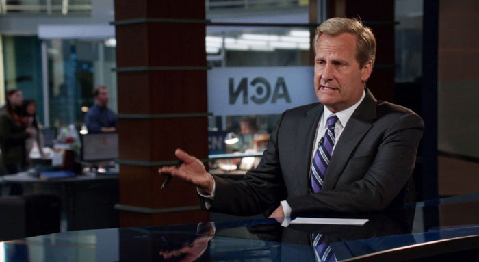 News reposter sitting and gesticulating with hands 