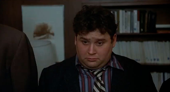 Dean Vernon Wormer from National Lampoon's Animal House movie looking down