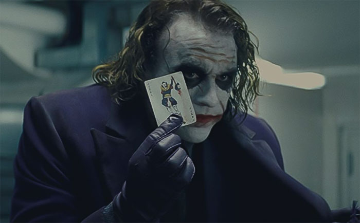 Joker holding joker card 