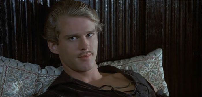 Westley from The Princess Bride lying on the bed and looking straight