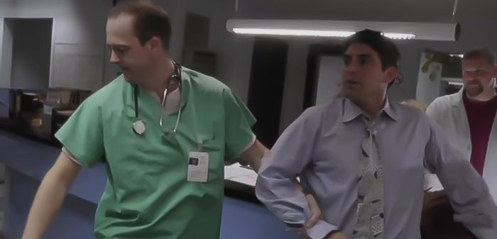 Noah with patient walking from ER 24 Hours