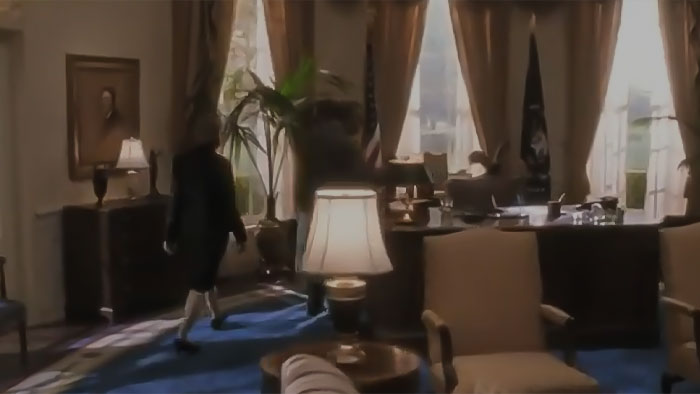 Woman walking in the room from West Wing pilot