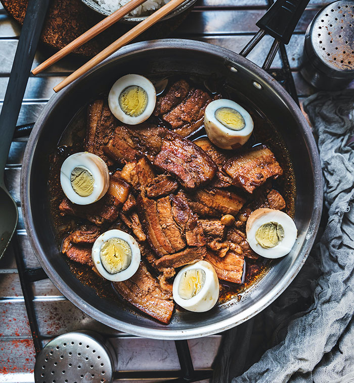Pork with eggs beside the bowl of rice