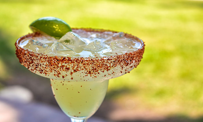 A close up of a drink in a glass on a table