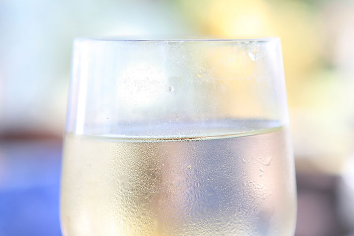 Close-up photography of glass of white wine