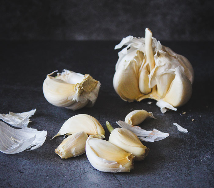 White garlic on black table