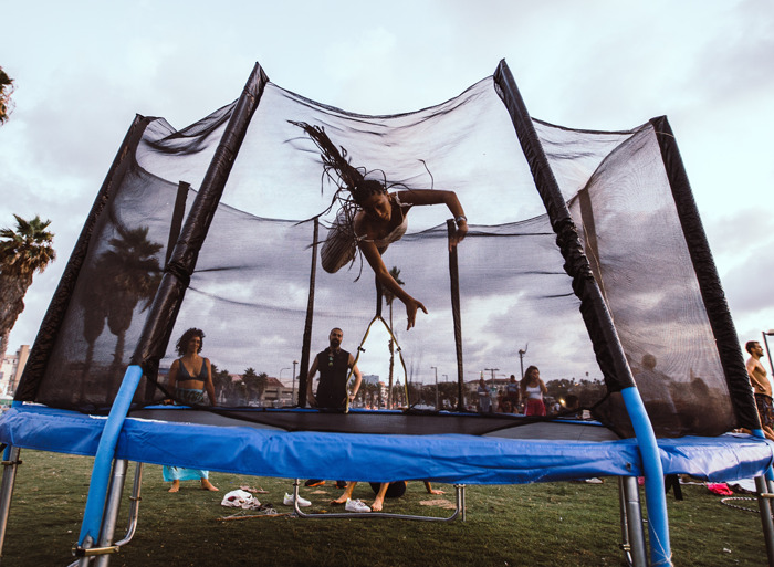 the woman jumping on the trampoline