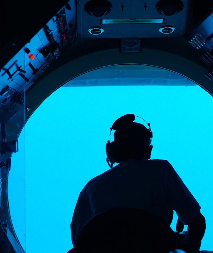 person sitting in the submarine