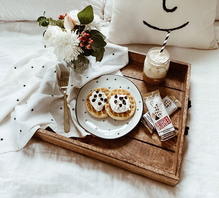 Breakfast pancakes with cocoa in bed