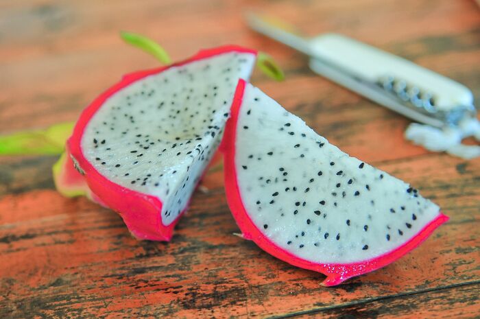 Sliced up Dragonfruit on a table 