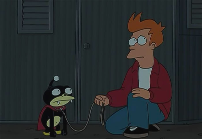 Fry holding Nibbler from Futurama