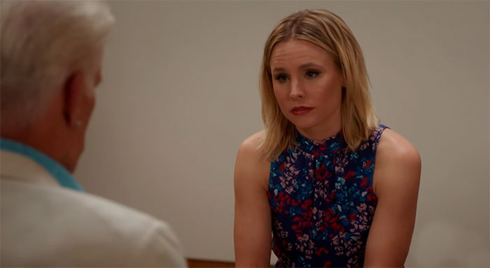 Eleanor wearing a dress with flower print 