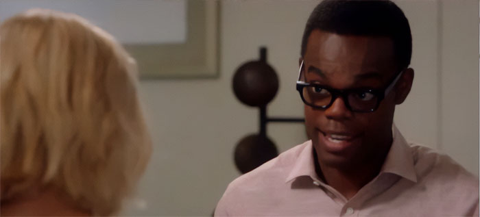 Chidi wearing pink shirt 