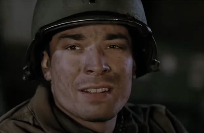 Actor in a military helmet with a serious expression, highlighting the art of roasting people timelessly.