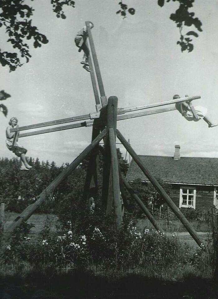 A Family Plays On A Unique Four Person Homemade Swing In Finland, 1954