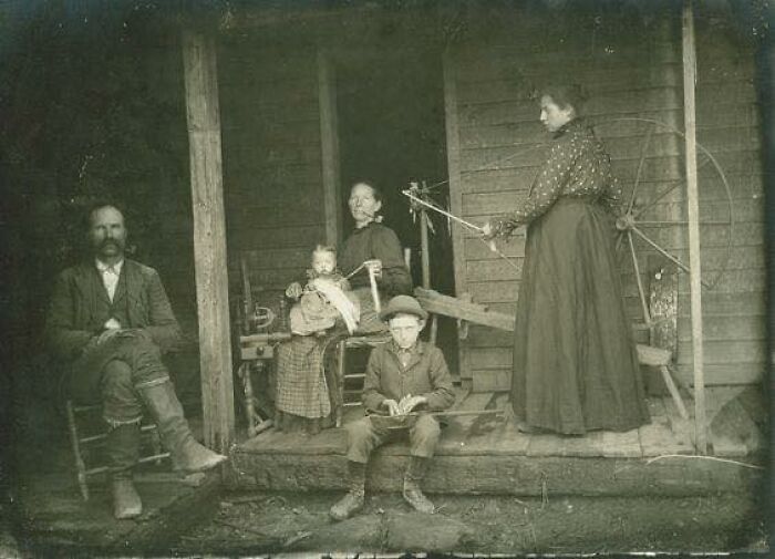 Kentucky Family Undertaking Spinning Activities On The Porch Of Their Appalachian Mountain Home