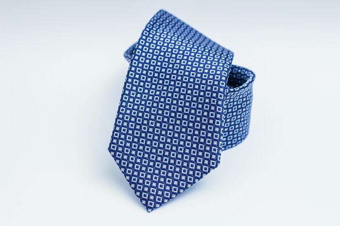 Blue necktie in white background