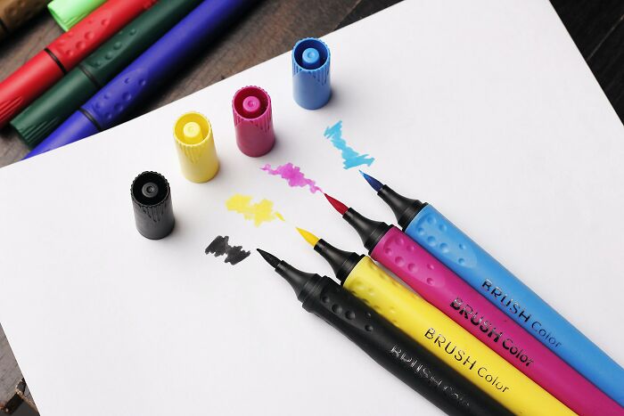 Four different Scented markers on a piece of paper 