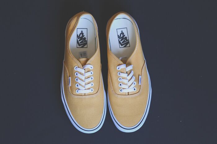 Yellow pair of Vans shoes 