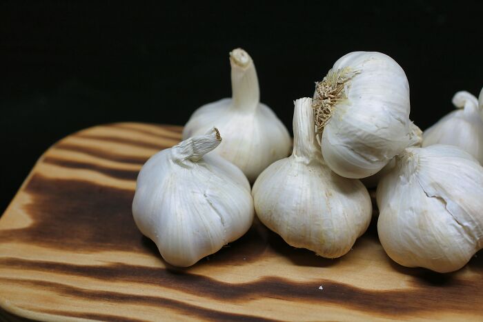 Multiple garlic's on a wooden table 