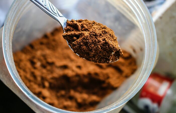 Cocoa powder in a metal spoon 