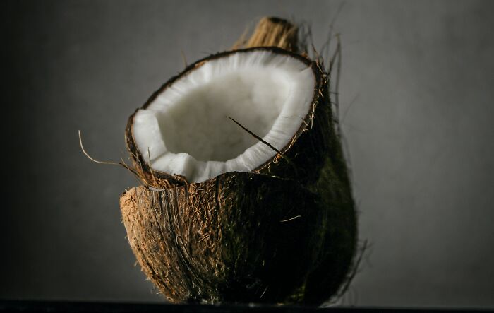 Split coconut in half 