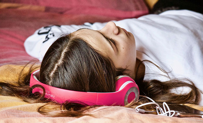 Girl with pink headphones