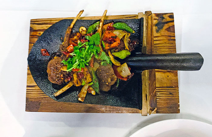 We Ordered A Hot Plate Of Cumin Lamb Chops At A Fancy Chinese Restaurant And It Came Out On A Shovel