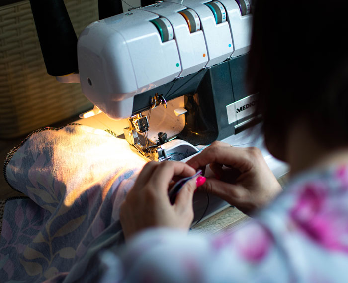 Woman sewing clothes
