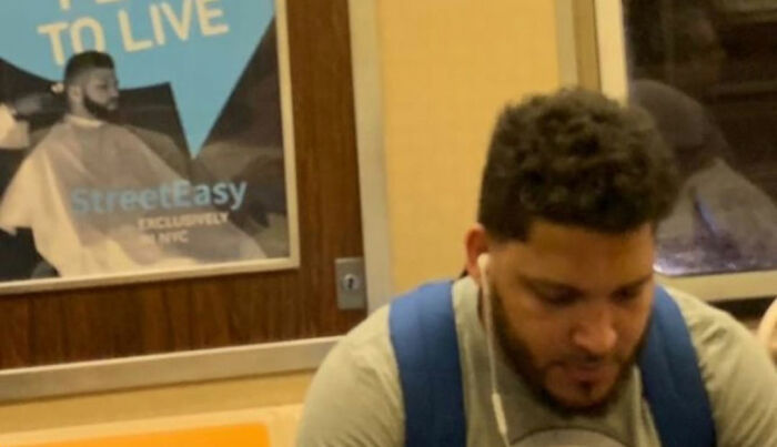 People Sitting Under Signs That Resemble Them