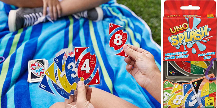 Person holding uno cards 
