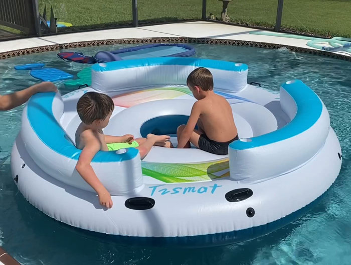 Kids playing in the inflatable floating island 