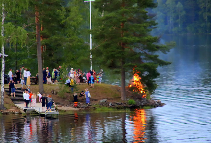 People burning bonfires near river