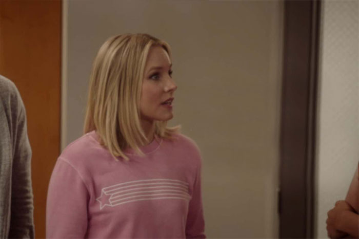 Eleanor wearing pink sweater 