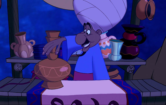 The merchant in Aladdin touching cups