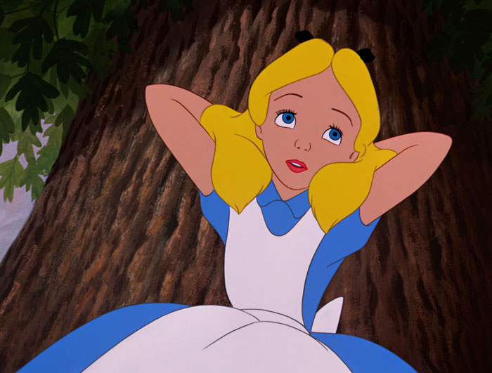 Alice standing near tree from Alice in Wonderland