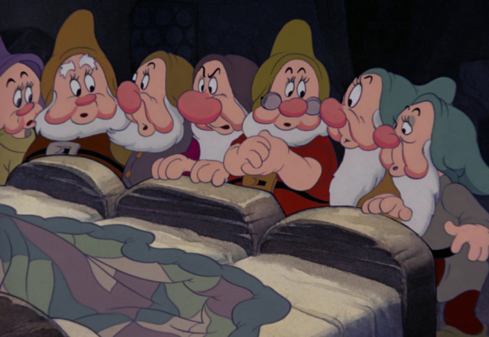 Dwarfs looking from Snow White
