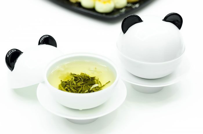 cups in the form of panda with tea