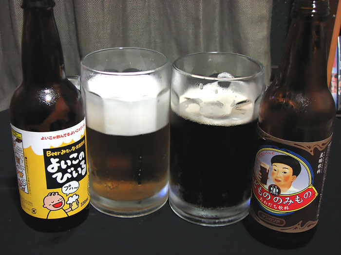 two bottles of kidsbeer near two glasses
