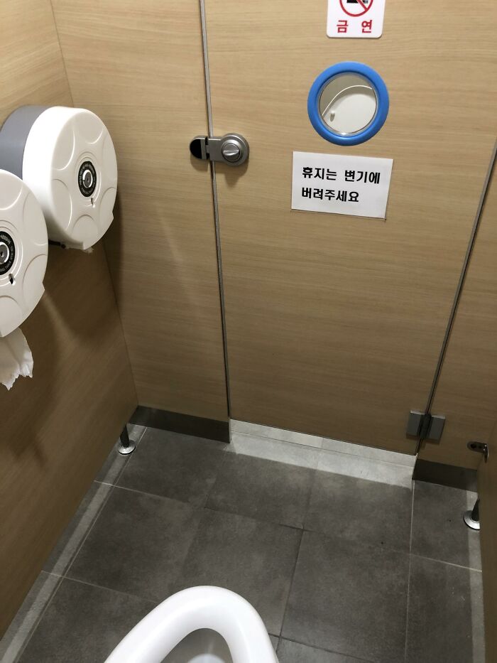 Mirror on door in public bathrooms 