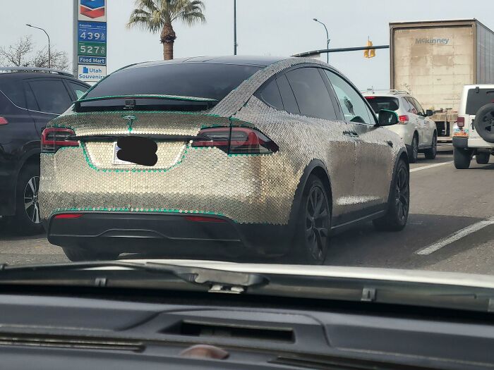 A Green Tesla Someone Covered In Nickels For Some Reason