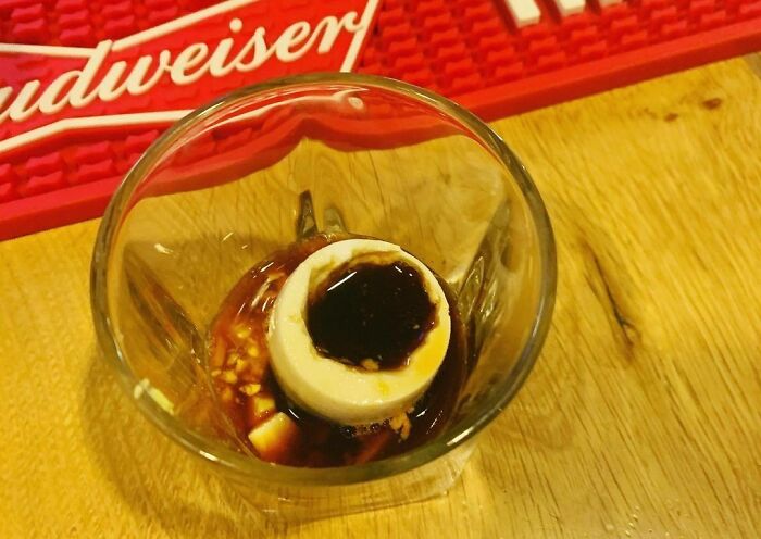 an ice-cream with liquides in the glass