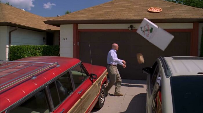 In This Scene From Breaking Bad (2010), Walter Throws A Pizza On His Roof In Anger. This Is Because He Accidentally Doxxed Himself