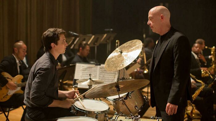 In Whiplash (2014), Terrence Fletcher Is Extremely Hard On Young Drummer Andrew Neiman. This Is Because Andrew Is A Criminal, That's Who He Is! A Vigilante! A Public Menace!