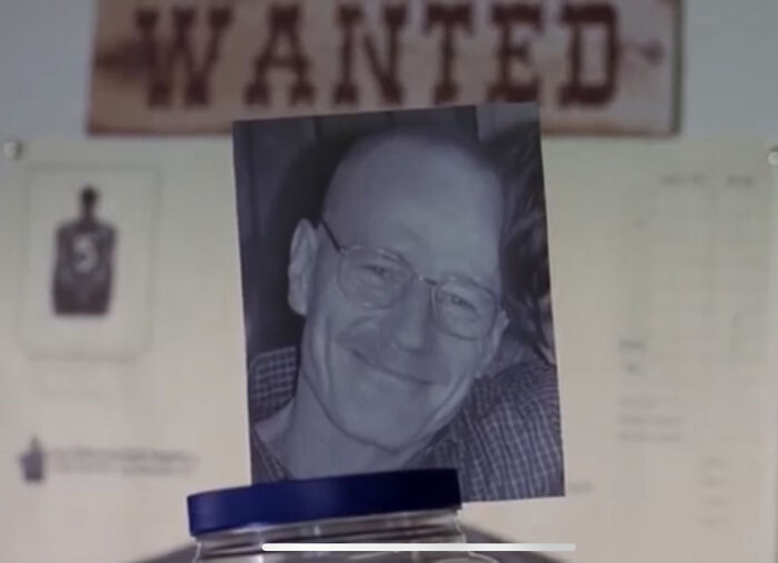 In Breaking Bad, There Is A Shot Showing A Picture Of Walt That Is Attached To The Cancer Charity Jar Hank Is Showing Of In The Police Station. This Angle Lines Up Perfectly To Show “Wanted” Above His Picture In The Background, Foreshadowing What’s To Come