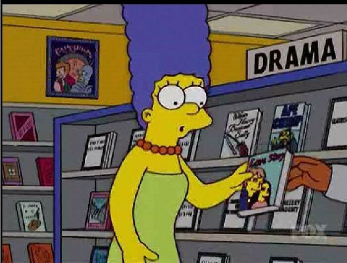 In The Simpsons Episode “Catch ‘Em If You Can” (S15e18, 2004), When Homer And Marge Are At Lackluster Video Looking For A Movie To Rent, There Is A Futurama Poster On The Wall